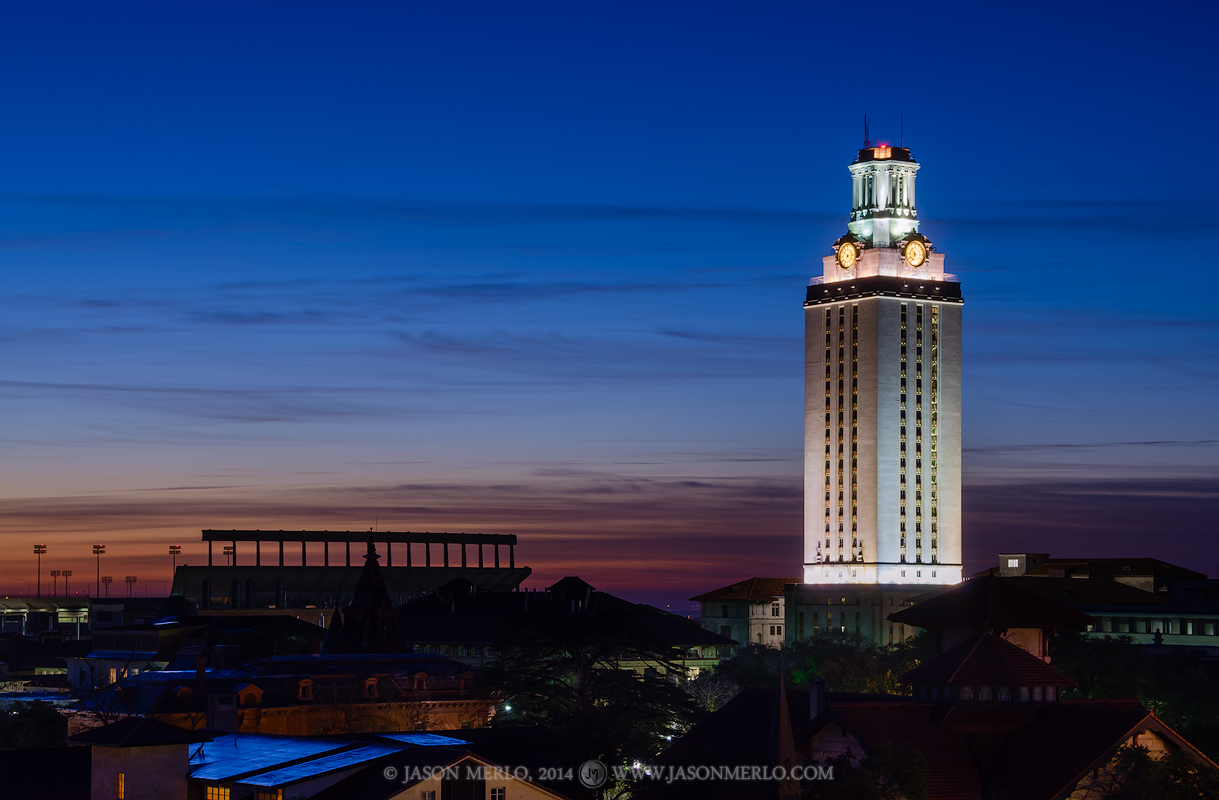 Dawn breaks over the campus of the Univerisity of Texas in Austin, Texas. The Tower and Darrell K. Royal - Texas Memorial Stadium...