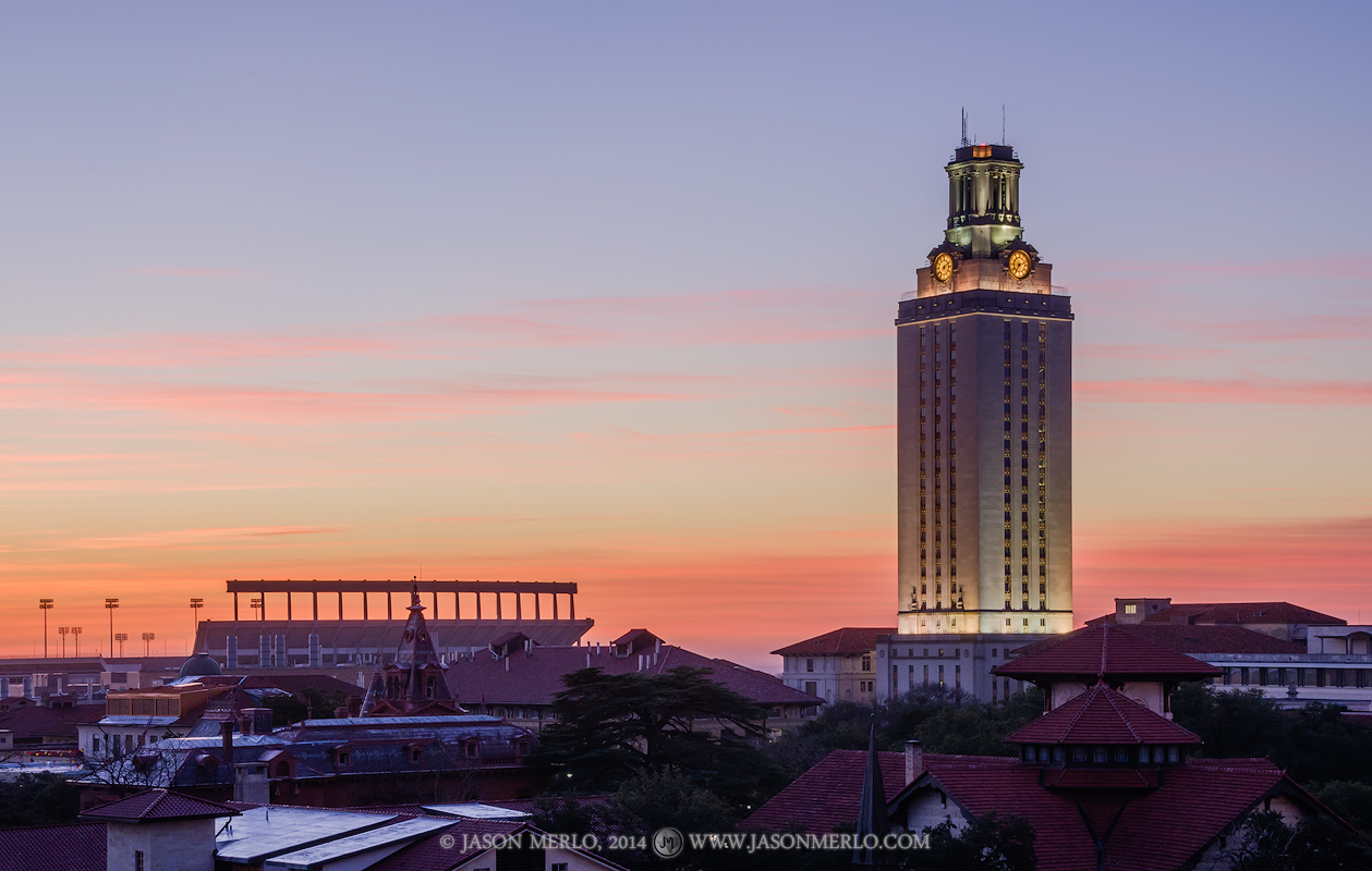 The sun casts color on clouds over the campus of the Univerisity of Texas in Austin, Texas just before sunrise. The Tower and...