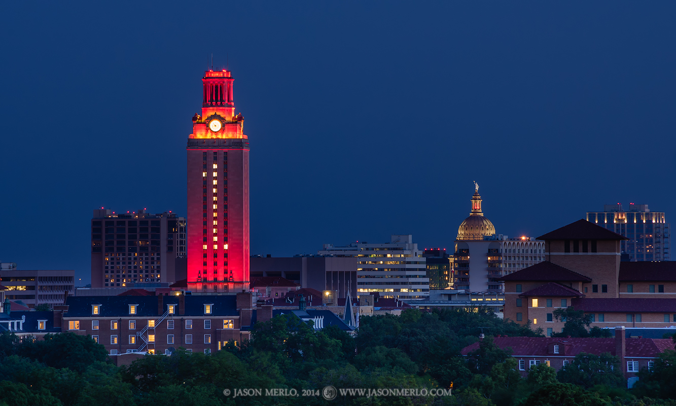 The University of Texas Tower lit orange with #1 for the filming of My All American and the Texas State Capitol dome at dusk...