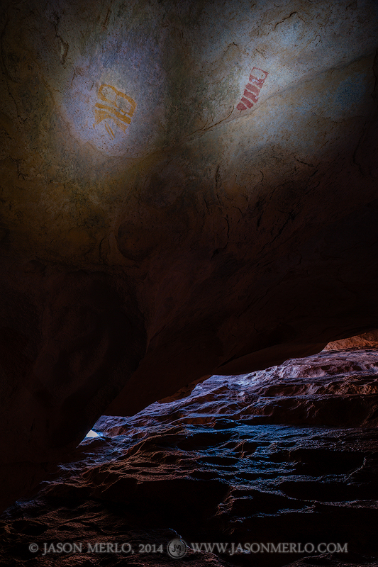 Painted masks over the entrance to a cave at Hueco Tanks State Park and Historic Site in El Paso County in West Texas.