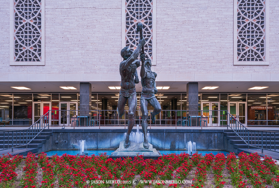 Flawn Academic Center and the Torchbearers statue at the University of Texas in Austin, Texas.