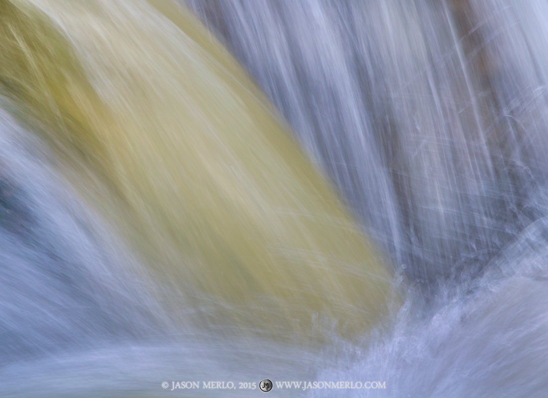 Muddy water pours over Lower McKinney Falls after heavy rains at McKinney Falls State Park in Austin in the Texas Hill Country...