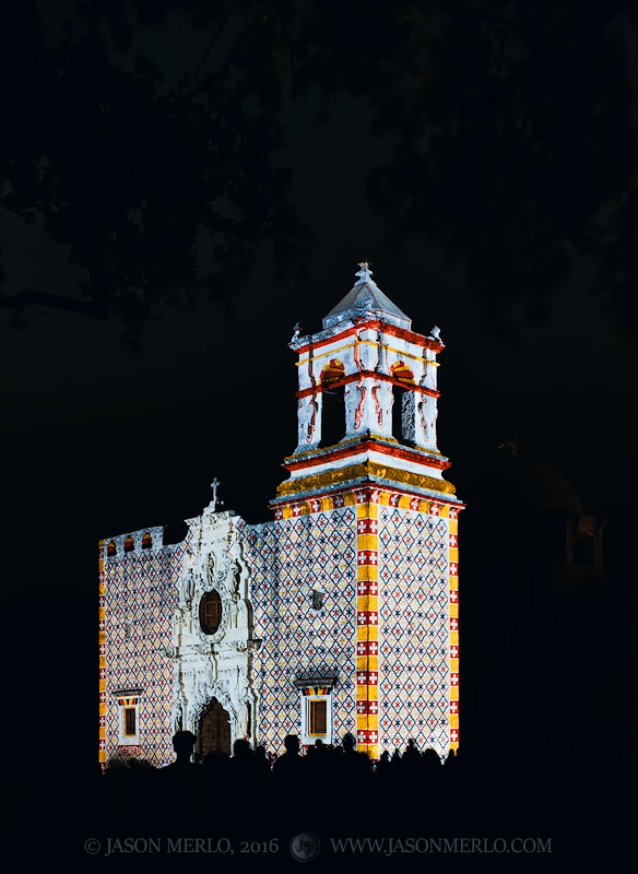 Historic patterns projected on the chapel façade during the Restored by Light program at Mission San José in San Antonio, Texas...