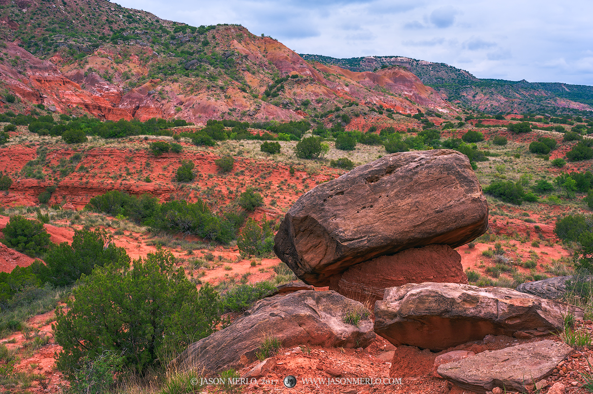 A hoodoo and boulders beneath mineral rich hills&nbsp;at Palo Duro Canyon State Park near in Randall County in the Texas Panhandle...