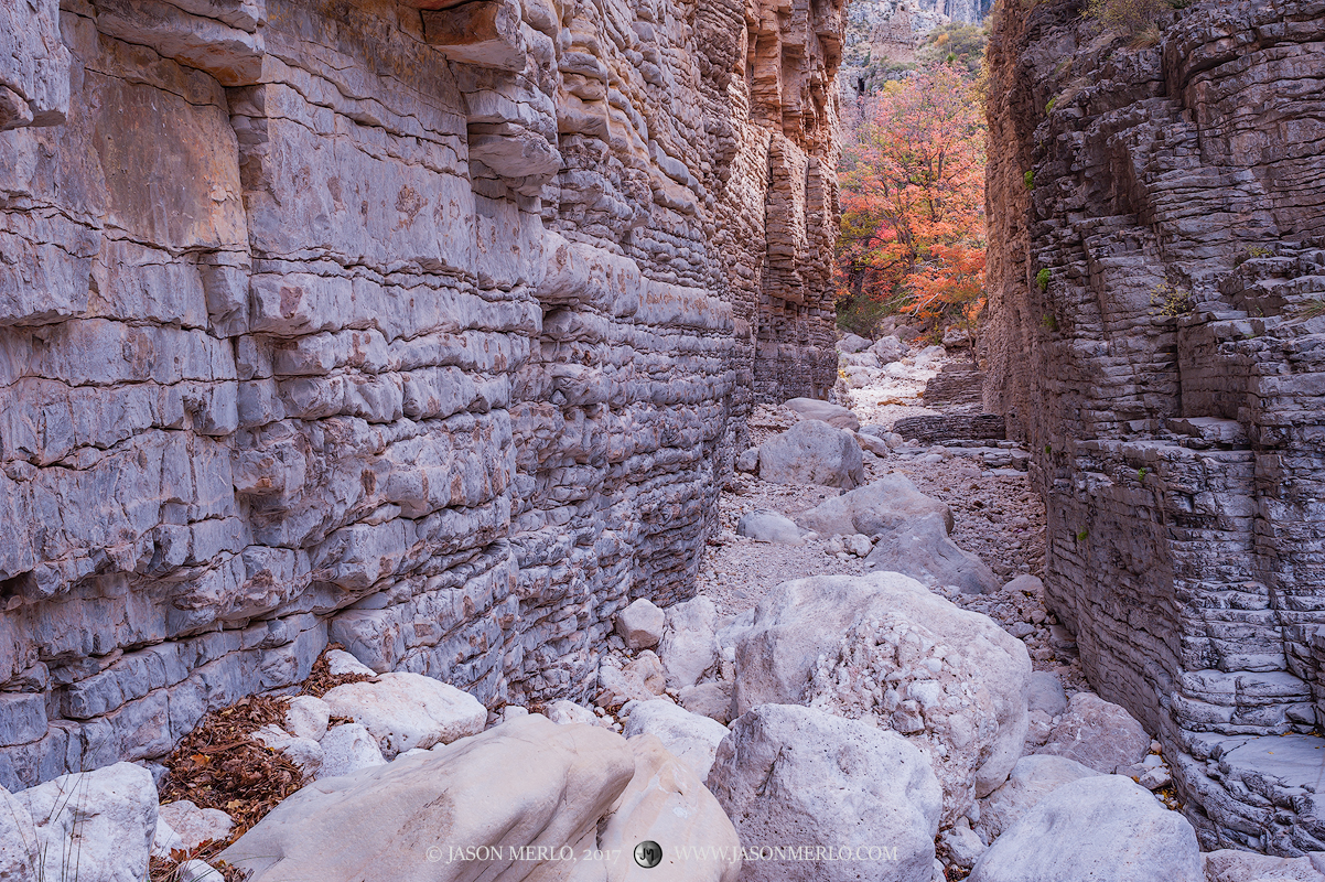 Limestone boulders at the entrance to a slot canyon known as the Devil's Hall in Guadalupe Mountains National Park in Culberson...