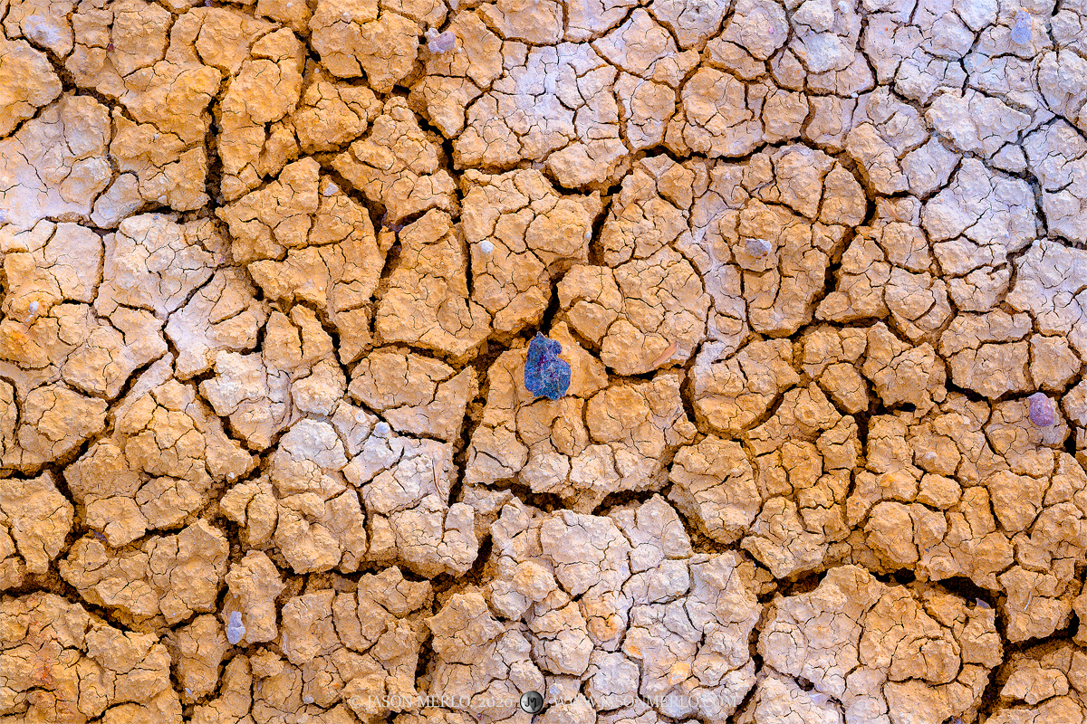 Cracked earth and pebbles in the badlands of Big Bend National Park in West Texas.